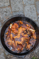 Africa chicken wings and breast with chili spice mixture in the dutch oven.