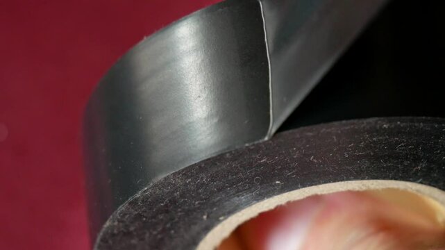 Roll of black electrical tape for electronics repair