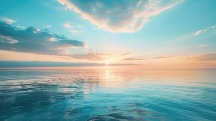 Sunset reflecting on the sea under a blue sky