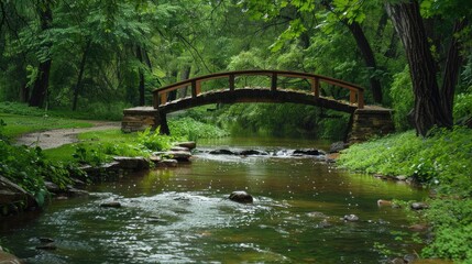 Fototapeta premium Streamside bridge in the park post rain