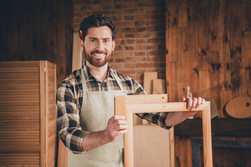 Photo of successful master man working with wood planks create perfect portrait frames measure size indoors his workshop