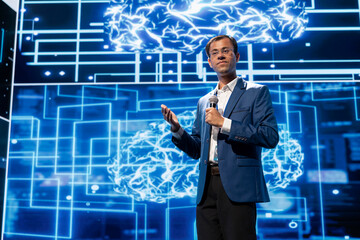 Expert talking at AI tech summit event gathering professionals seeking to discover latest AI...
