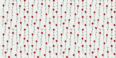 seamless minimalistic embroidery pattern of small red roses, on a plain white linen