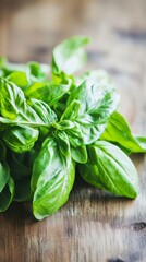 Obraz premium a bunch of basil leaves herb on a wooden surface