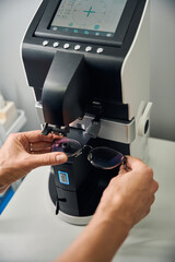 Glasses being measured with a lensometer in office