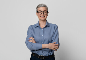 Female Entrepreneurship. Portrait Of Attractive Mature Businesswoman In Eyeglasses Posing With...