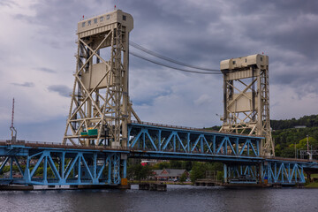 Naklejka premium A Double Deck Lift Bridge Crossing A River