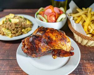grilled chicken with french fries, chaufa rice and fresh salad