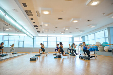 Group of women are training in front of a mirror