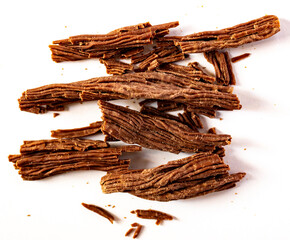 Chunks of milk chocolate on white background. Chocolate in the shape of a branch