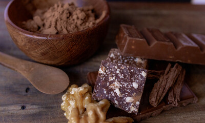 Cocoa powder and ingredients on wooden background.Culinary concept