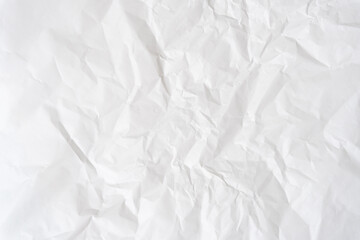 Top view and full frame of wrinkled or crumpled white paper texture used as crumpled white paper background texture in decorative art work