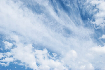 gentle white clouds in the blue sky