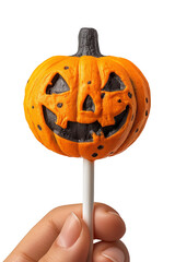Trick or treat candy idea with halloween pumpkin lollipop in hand isolated on white background. Sweets food. Halloween party, invitation, greeting or gift card.