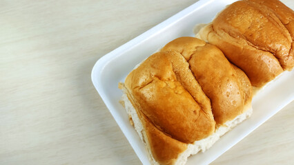 Traditional homade brazilian bread known as pão doce or sweet bread on the plate.
