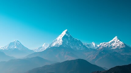Obraz premium Majestic snow-capped mountain range under clear blue sky, showcasing the breathtaking beauty of towering peaks, pristine wilderness, and serene natural landscape. High resolution, perfect for nature, 