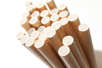 Many bamboo drinking straws on white background, closeup
