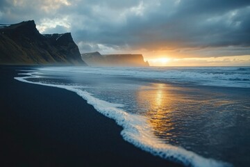 Black Sand Beach with Waves and Sunset Behind Cliffs