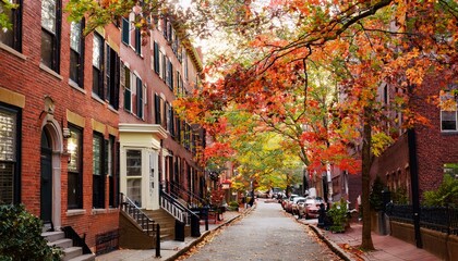 Fototapeta premium A vibrant Boston street on a fall afternoon, red-brick brownstones covered in wild grape vines, golden sunlight, autumn leaves, and a soft breeze, blending city charm with natural beauty.