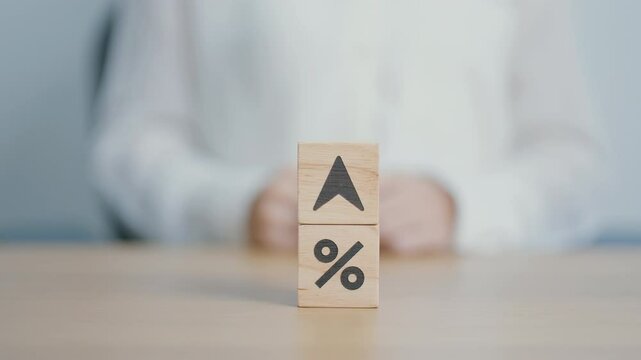 wood block of percentage change to UP and Down arrow. Interest rate, GDP, stocks market, financial, deflation and Inflation, ranking, mortgage, debt, Loan and Economic Recession concept