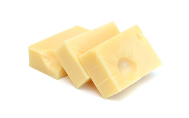 Cubes of cheddar cheese isolated on white