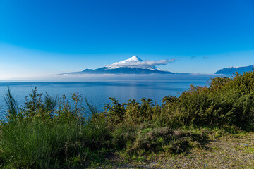 The snowy Osorno volcano by the lake Llanquihue seen from the road to Ensenada on a sunny winter day, Chilean Patagonia © Sergio Iglesias