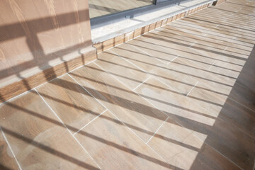 A Sunlit Outdoor Terrace Featuring Beautiful Shadow Patterns and Inviting Designs