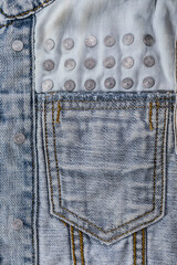 Close-up of blue denim jeans texture with visible pockets, showcasing casual fashion detail