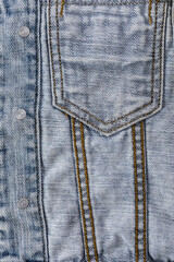 Close-up of blue denim jeans texture with visible pockets, showcasing casual fashion detail