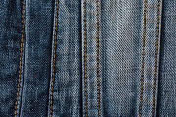 Close-up of blue denim jeans texture with visible pocket and seam