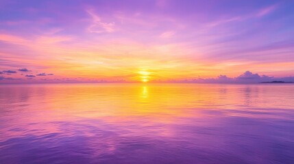 Fototapeta premium Pink and Orange Sunset Over Calm Sea Water