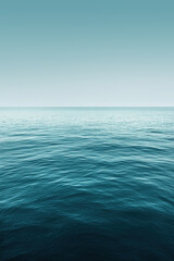 Ocean horizon stretching into distance under blue sky