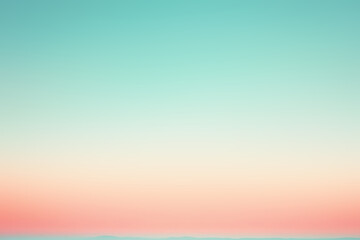 Turquoise sky fading into pastel pink and orange at sunset