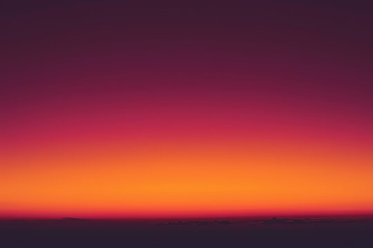 Dramatic orange and purple sunset over clouds