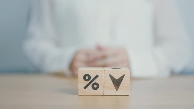 wood block of percentage change to UP and Down arrow. Interest rate, GDP, stocks market, financial, deflation and Inflation, ranking, mortgage, debt, Loan and Economic Recession concept