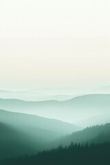 Fototapeta premium Green mountain landscape forming foggy layers during sunset