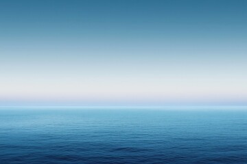 Obraz premium Calm ocean water merging with pale blue sky