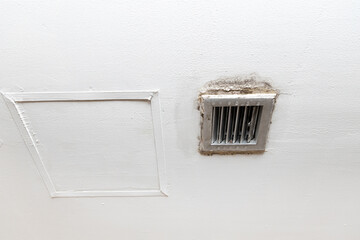 Water drop leak on air conditioner grille is ceiling stain and cracked and mold.