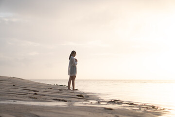 Woman at Sunset on the Beach