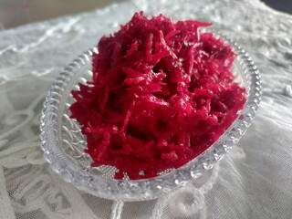 Grated beetroot in bowl.