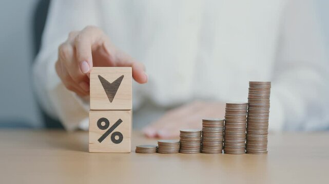 wood block of percentage change to UP and Down arrow with money coins stack. Interest rate, GDP, stocks market, financial, deflation and Inflation, ranking, mortgage, debt, Loan and Economic Recession