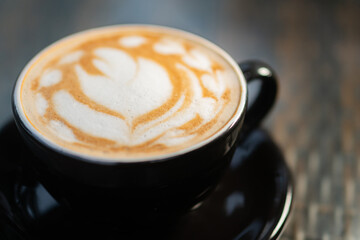 Artistic Latte in Black Cup