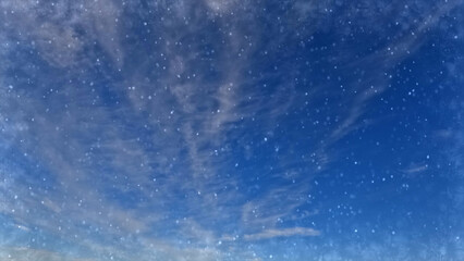 Obraz premium beautiful falling snow on clouds on sky background - photo of nature