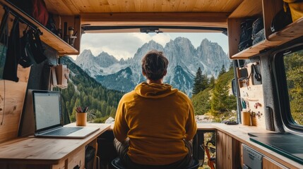 Digital nomad traveling in a camper van, mobile office setup with a scenic mountain view