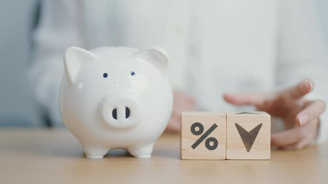 wood block of percentage change to UP and Down arrow with piggy. Interest rate, GDP, stocks market, financial, deflation and Inflation, ranking, mortgage, debt, Loan and Economic Recession