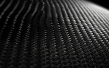 Black carbon fiber texture with woven pattern. Close-up macro shot for design and print.