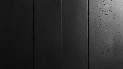 A close-up of a dark textured surface with rough, organic patterns, evoking a sense