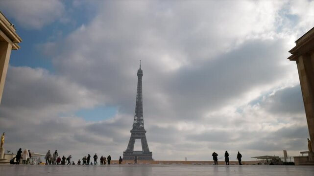 The breathtaking view of the iconic Eiffel Tower in Paris, beautifully framed by a moody sky, truly embodies the essence of romance and architectural beauty, captivating the hearts of all who see it