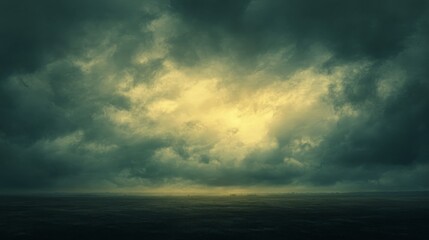 Obraz premium A dim twilight sky before dusk, with gray clouds hovering above and a soft, golden light faintly illuminating the distant horizon.