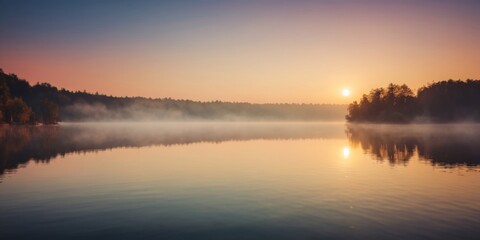 Naklejka premium Breathtaking Sunrise Over a Calm Lake with Mist Rising.